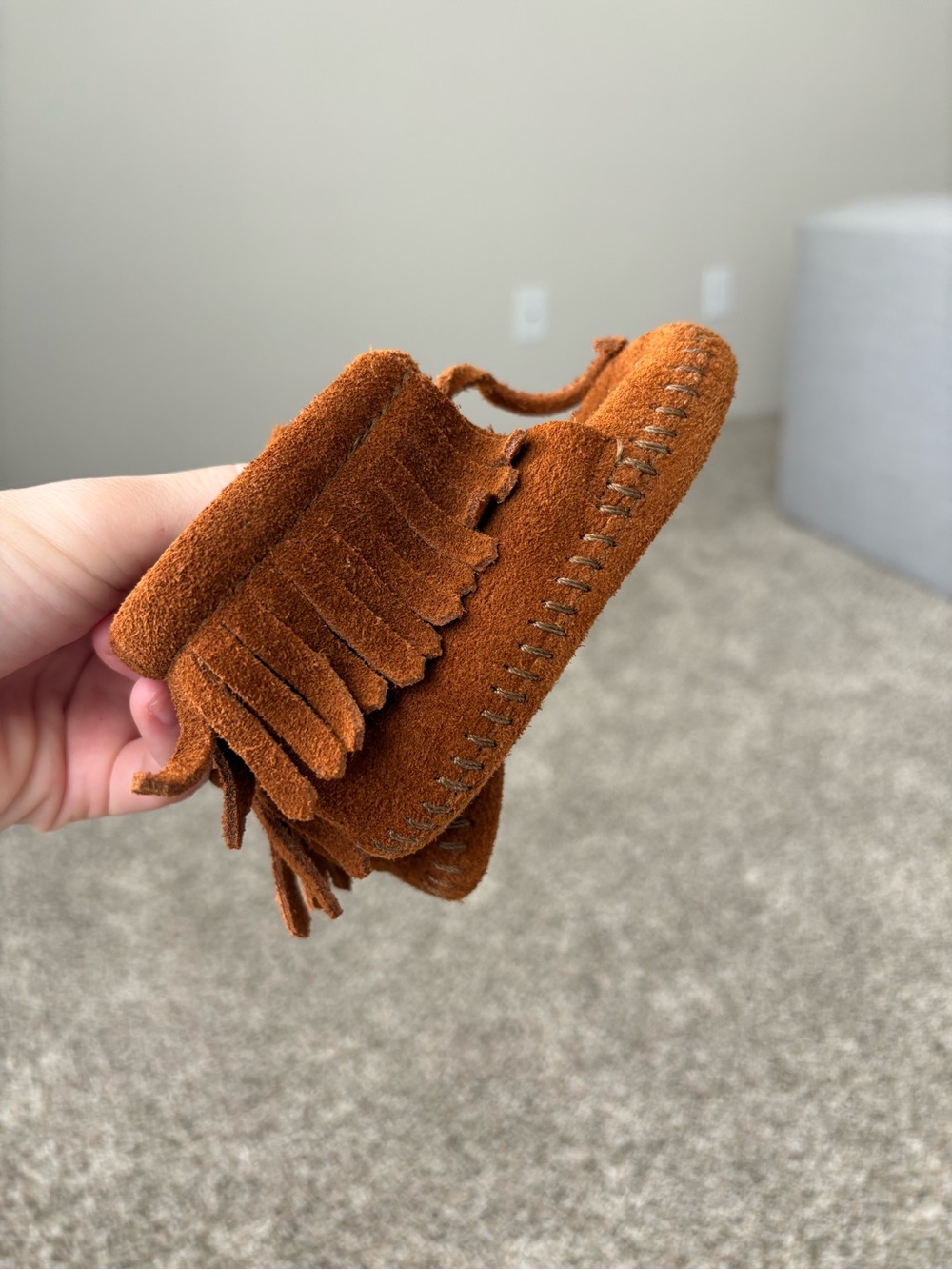 Minnetonka Baby Moccasins in Rust Suede with Fringe